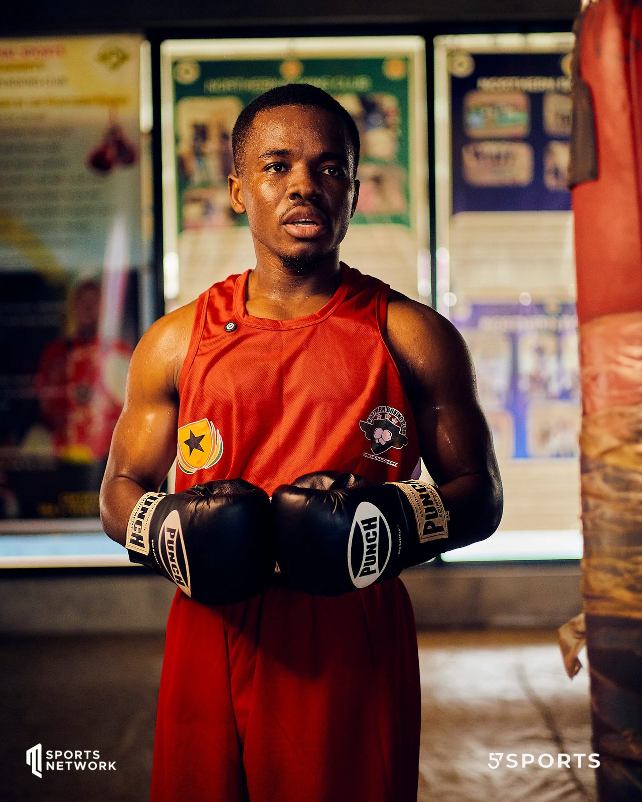 Fighter in red on the pads