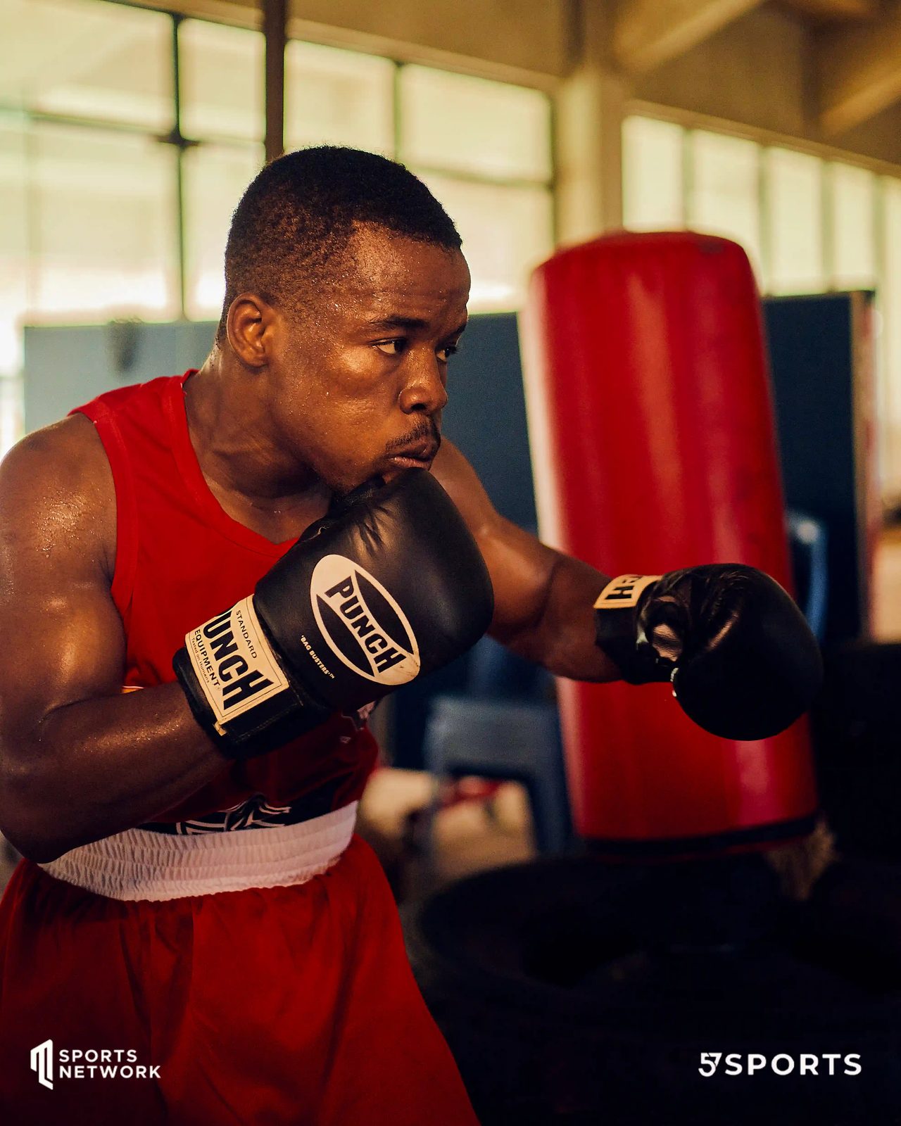 Boxer training by the heavy bag